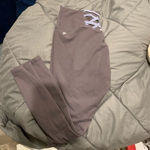 Fabletics powerhold 7/8 length medium with purple crosses on the back